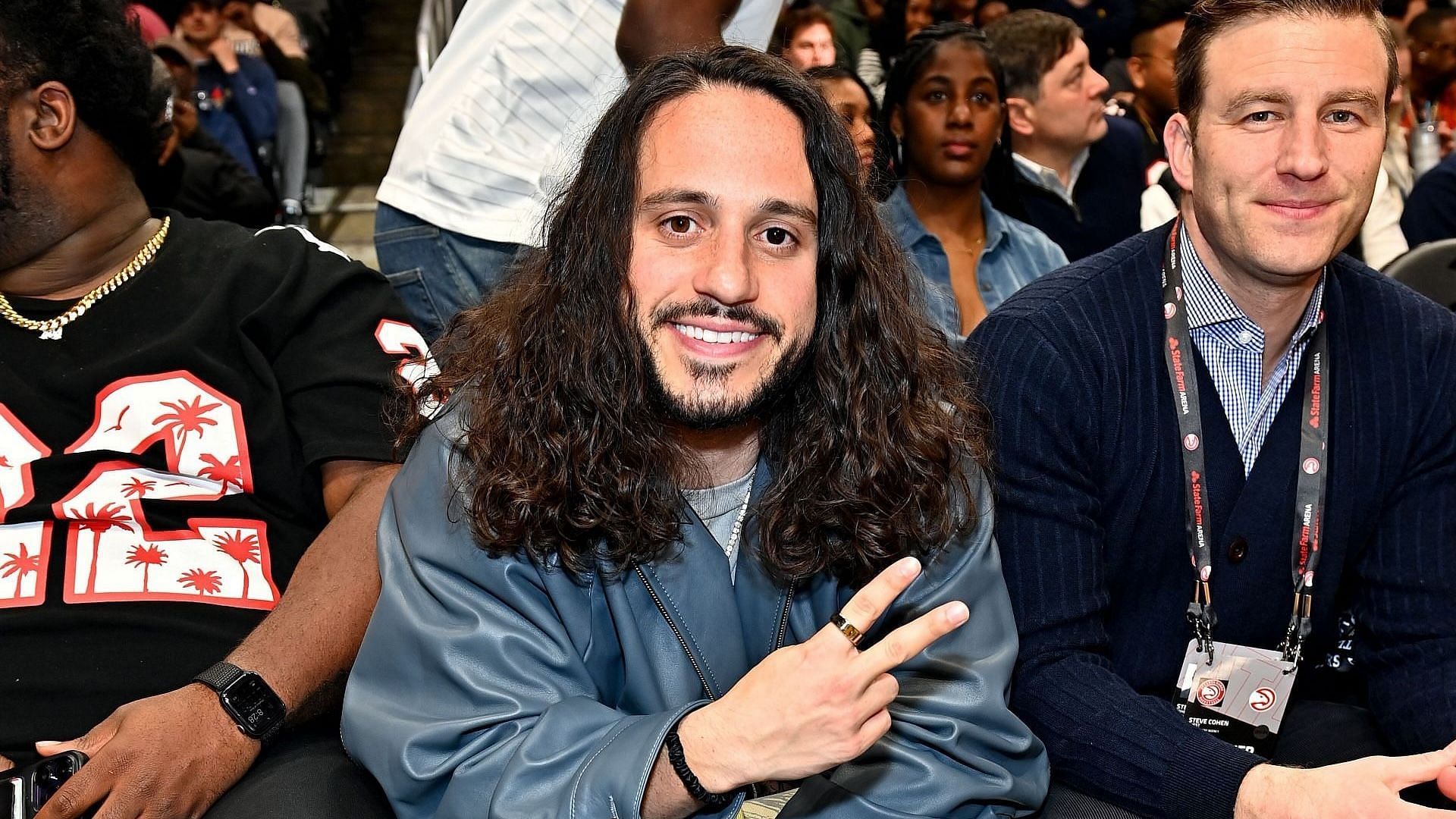 Rapper Russ attends the game between the Los Angeles Clippers and the Atlanta Hawks at the State Farm Arena on February 05, 2024, in Atlanta, Georgia. (Image via Getty/Paras Griffin)